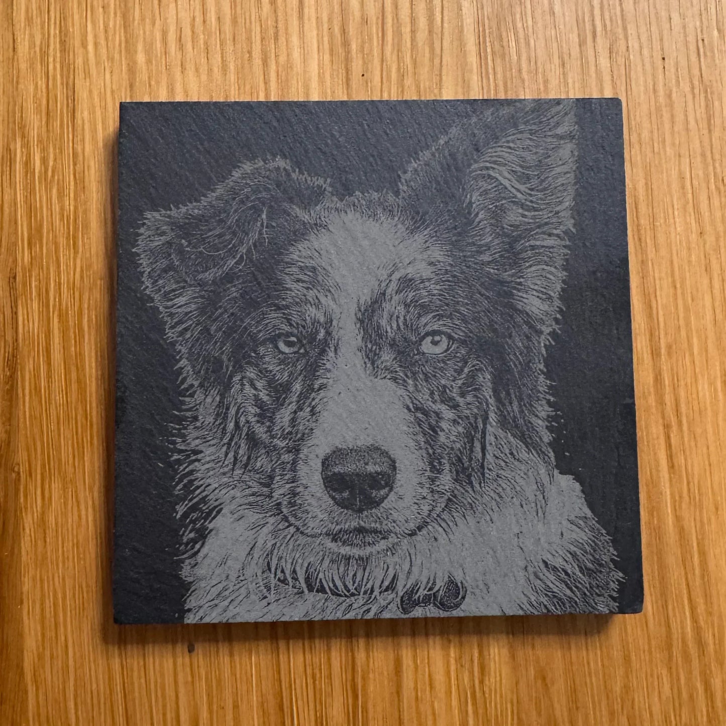 Slate coaster with engraved dog portrait, perfect for pet lovers and unique gifts
