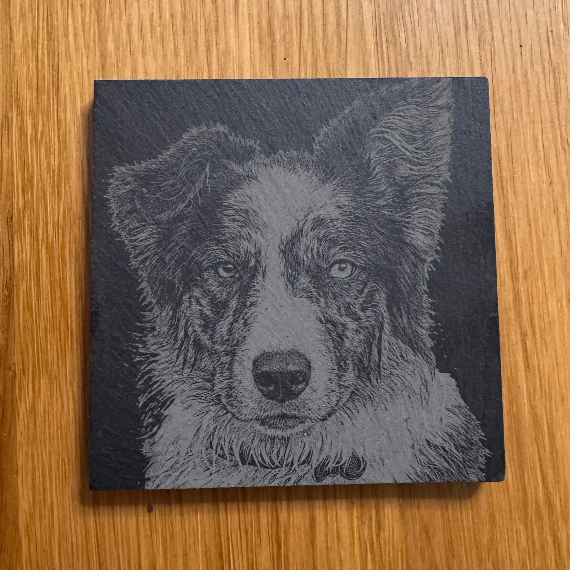 Slate coaster with engraved dog portrait, perfect for pet lovers and unique gifts