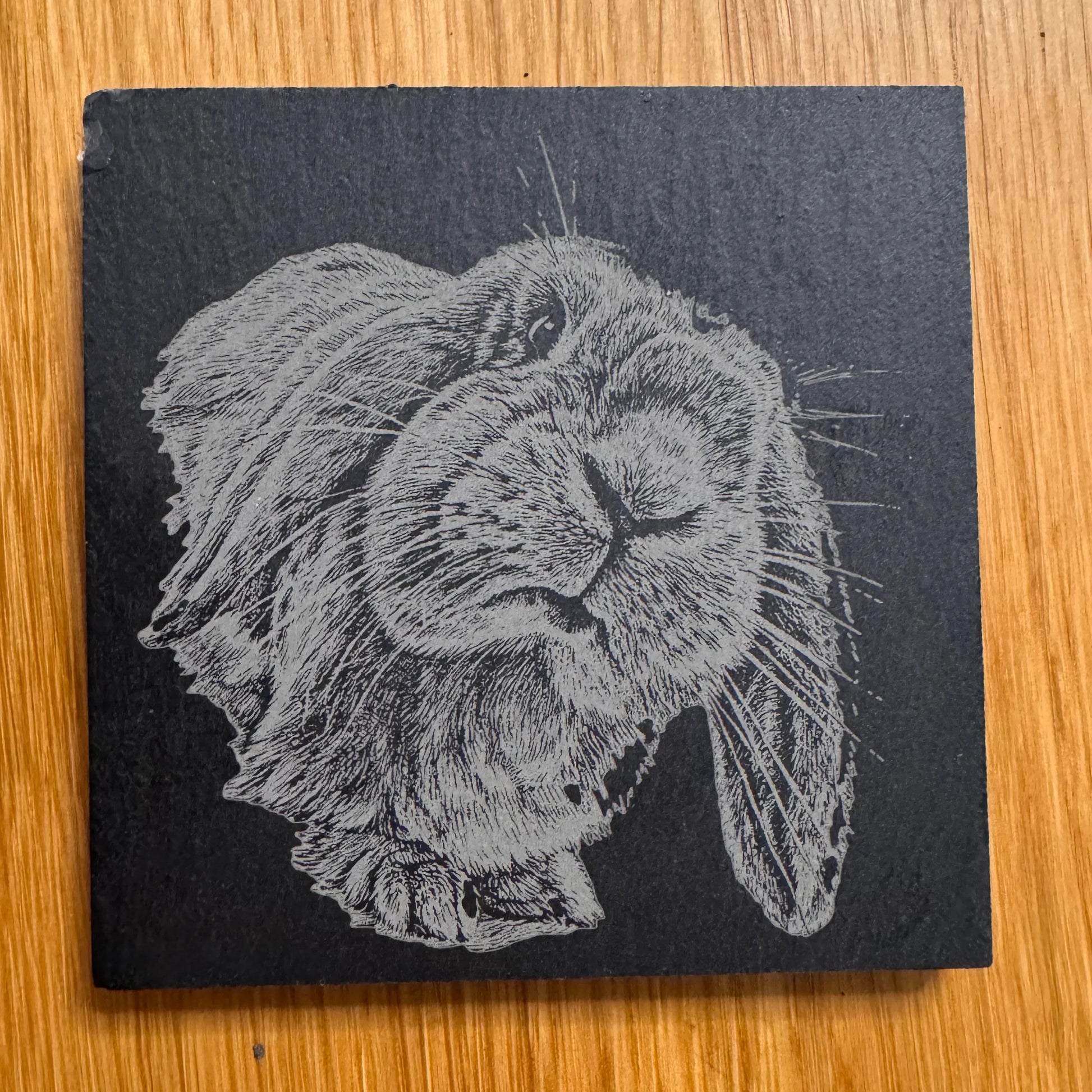 Square slate coaster with engraved rabbit design, perfect for unique homewares and thoughtful gifts.