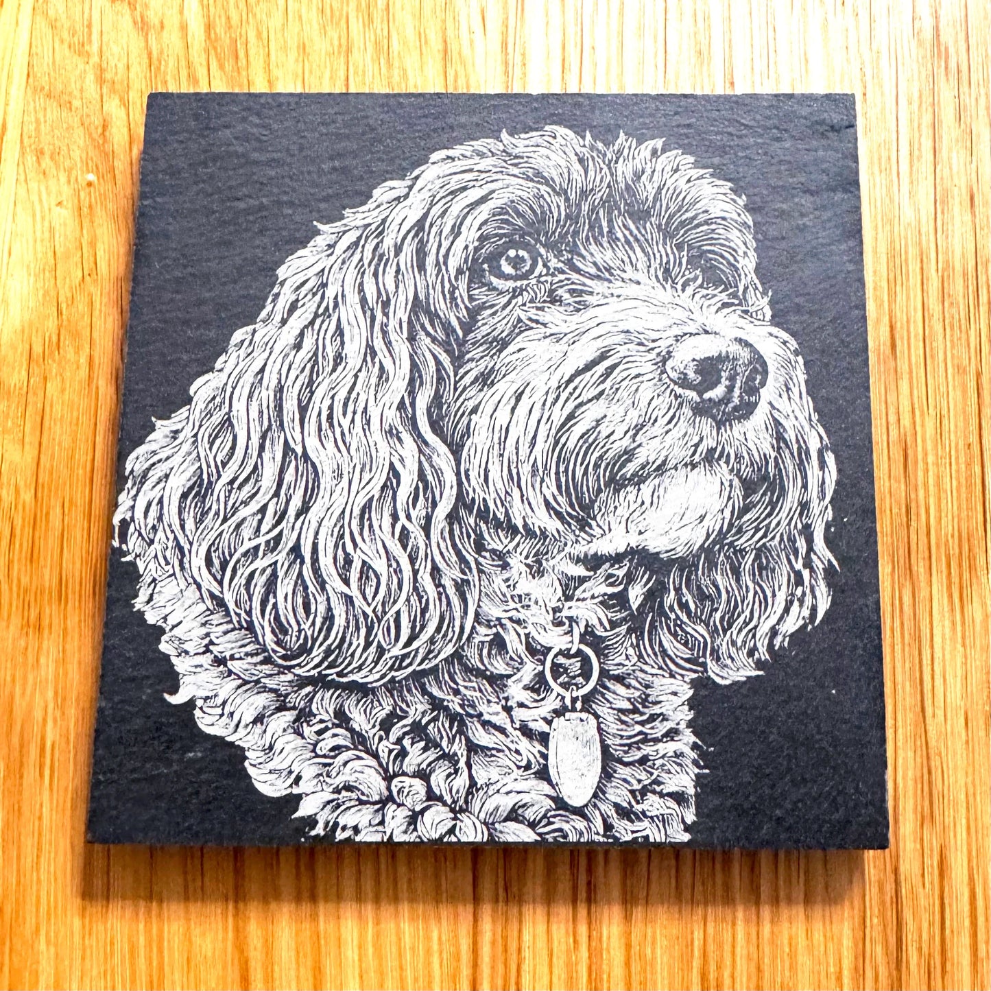 Slate coaster with detailed dog portrait, perfect for pet lovers and unique gifts.