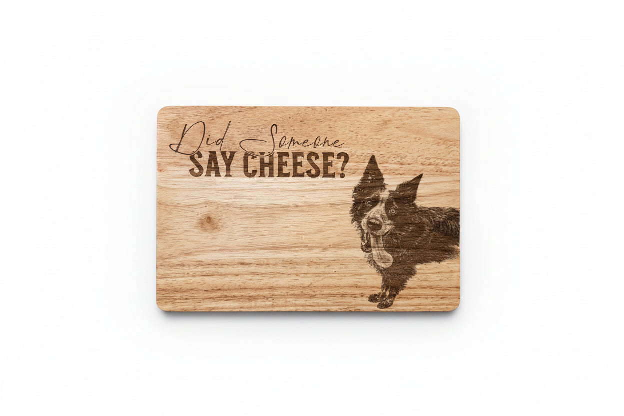 Wooden cutting board with a dog illustration and text 'Did someone say cheese?' on a wooden surface.